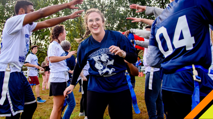 Student runs through group of other students. 